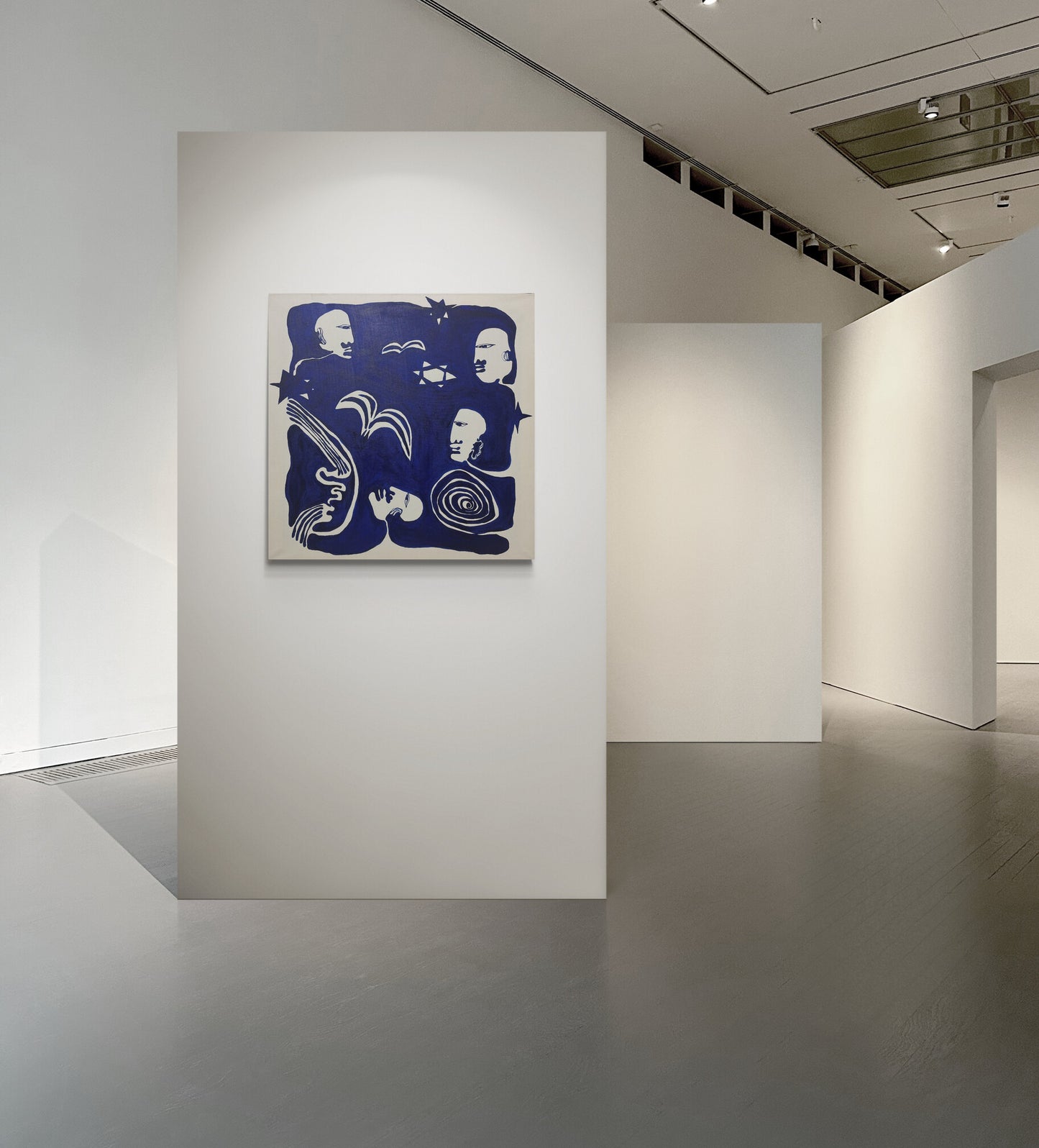 Art gallery with a blue abstract painting on a white wall