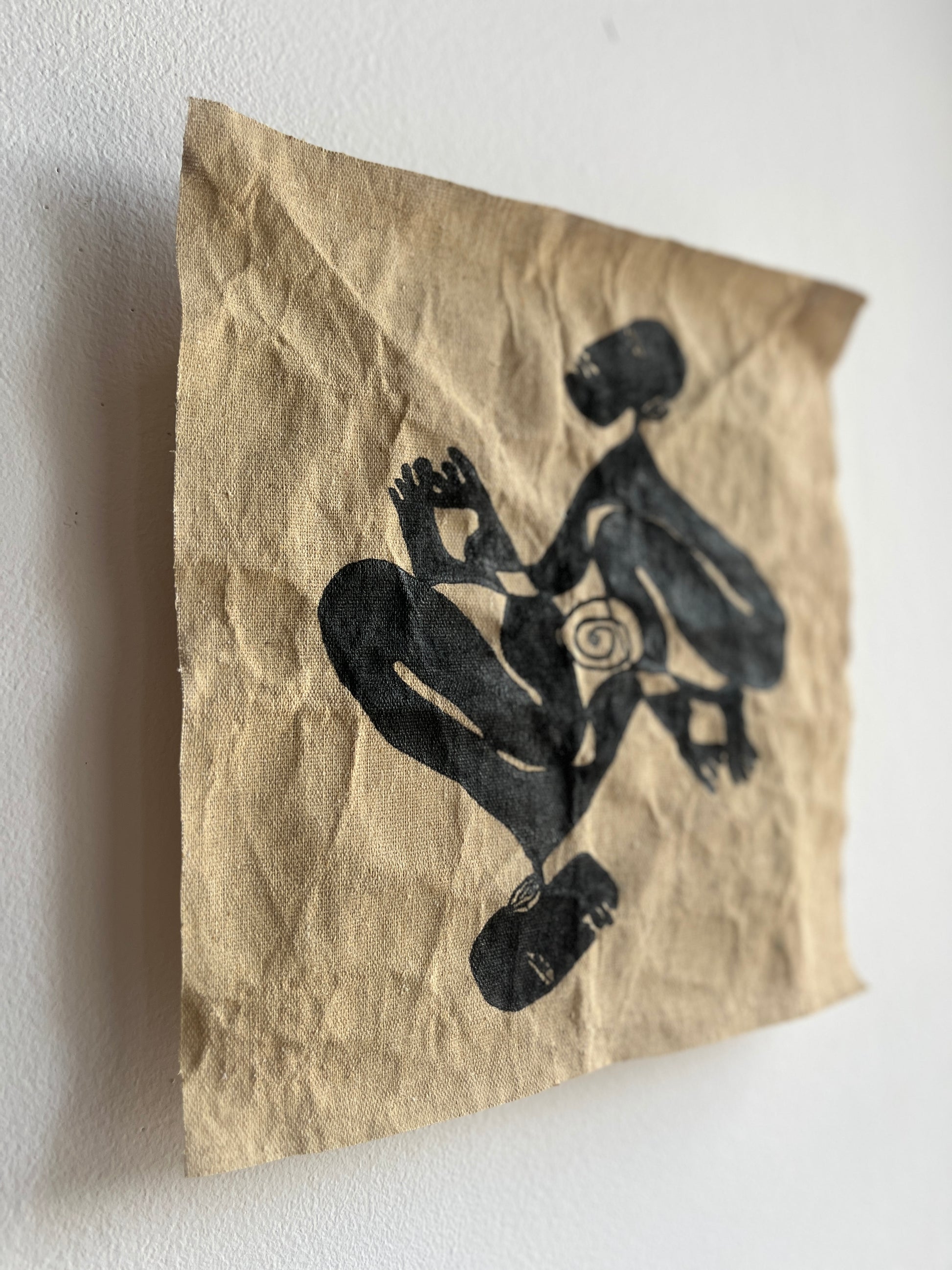 Abstract silhouette of two people on a raw canvas