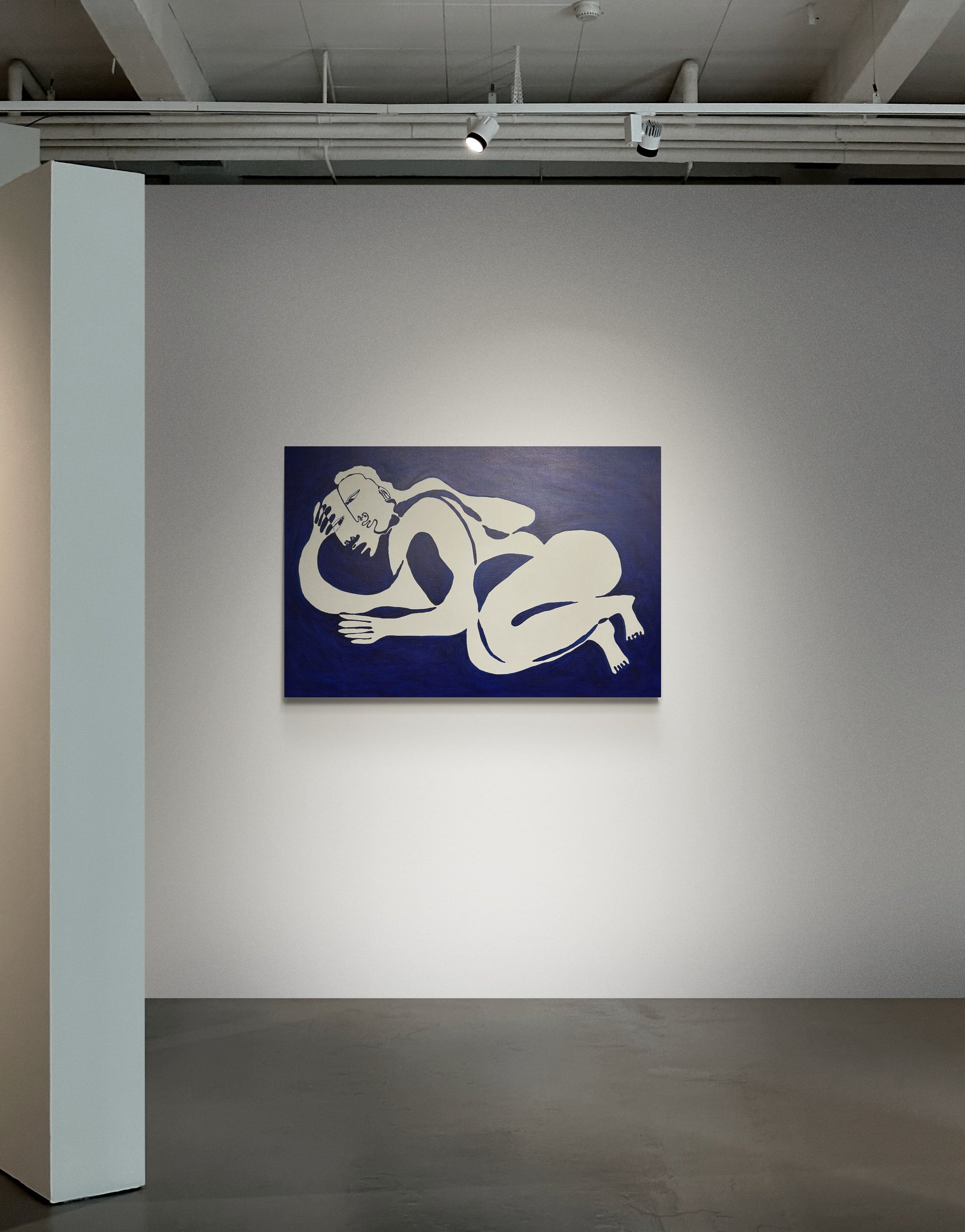 Abstract artwork of nude figures on a blue background in an art gallery.